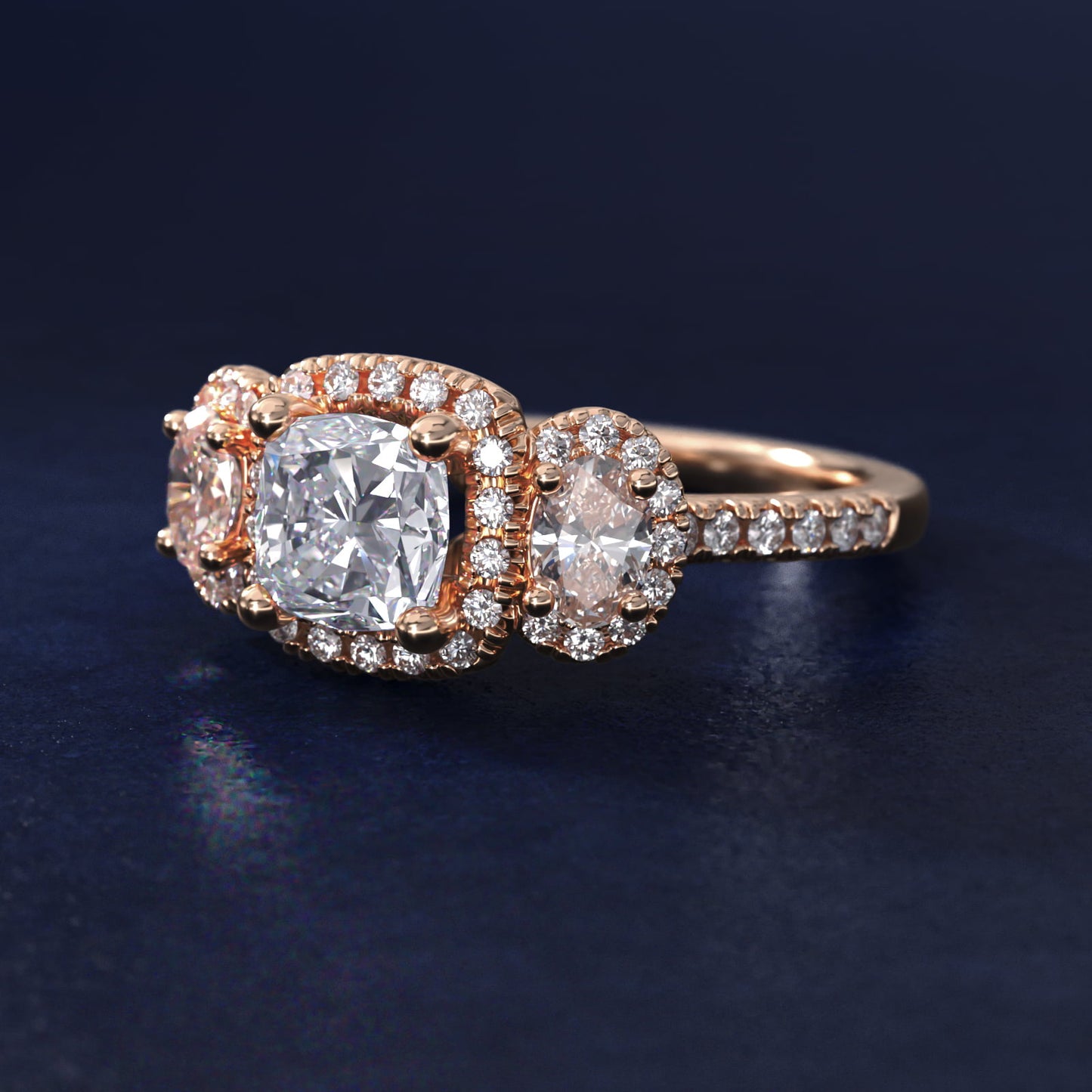 Three-Stone Oval Halo Diamond Engagement Ring in 18k Rose Gold - Cushion Center