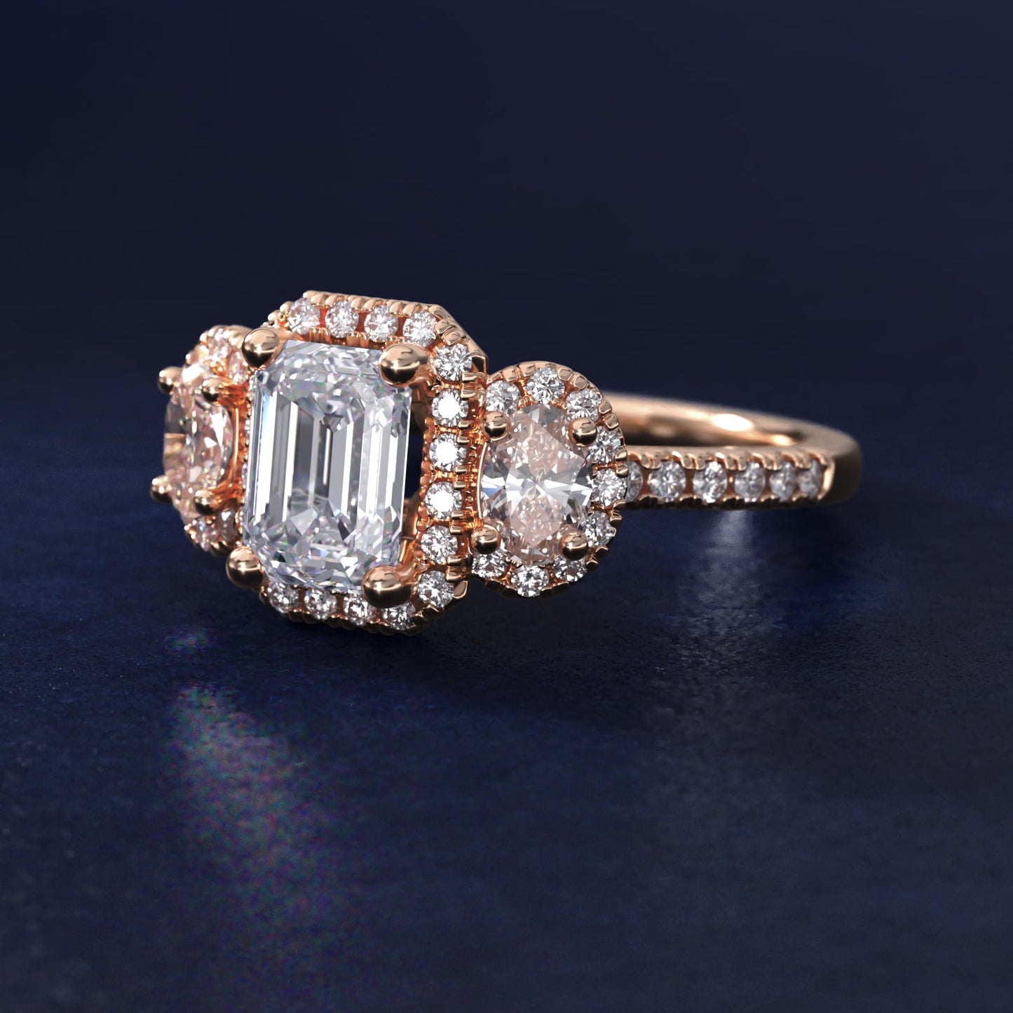Three-Stone Oval Halo Diamond Engagement Ring in 18k Rose Gold - Emerald Center