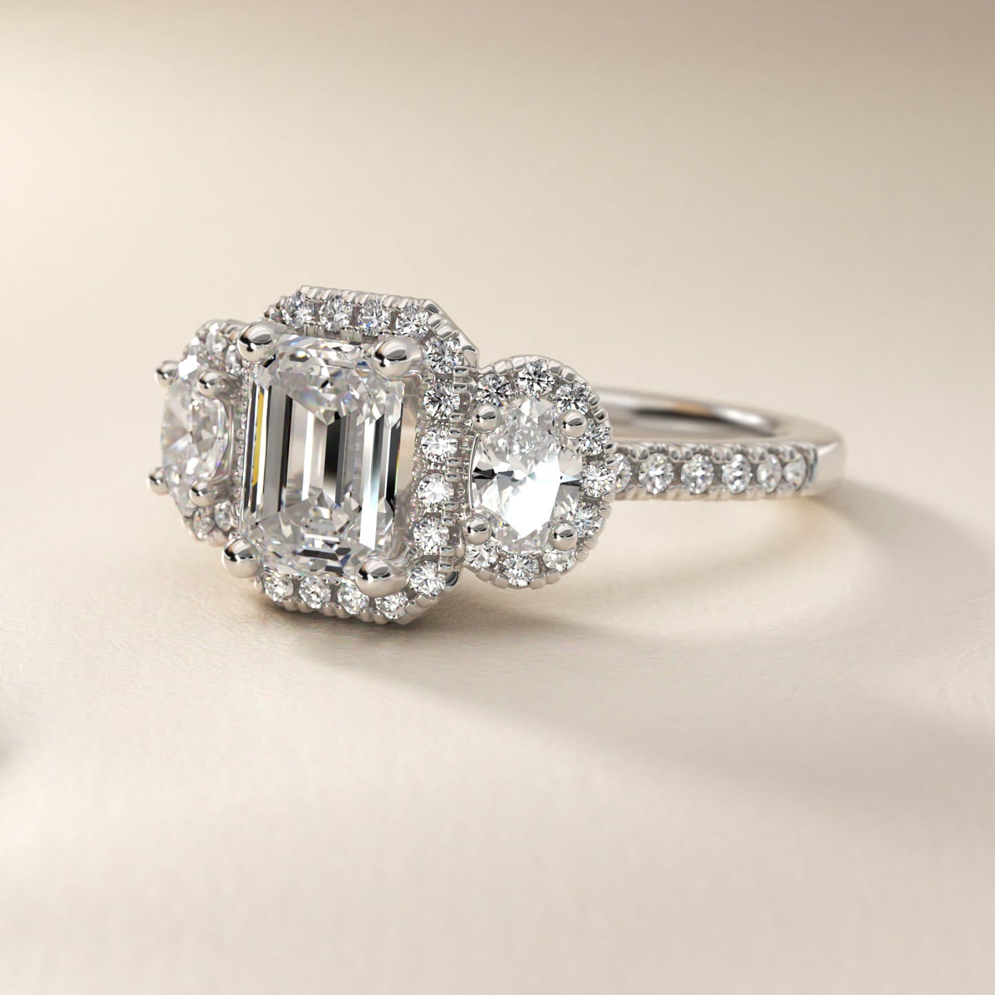 Three-Stone Oval Halo Diamond Engagement Ring in Platinum - Emerald Center