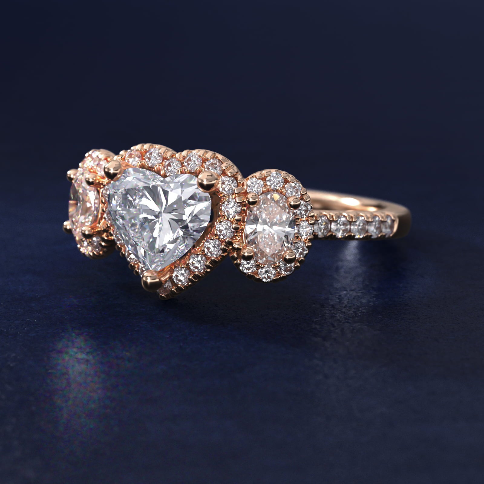 Three-Stone Oval Halo Diamond Engagement Ring in 18k Rose Gold - Heart Center