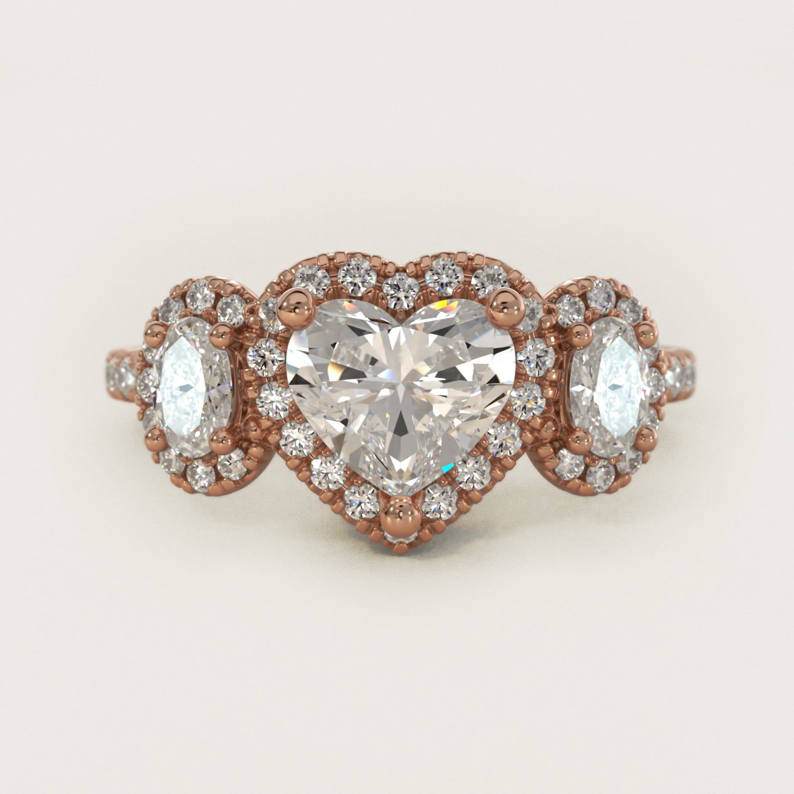 Three-Stone Oval Halo Diamond Engagement Ring in 18k Rose Gold - Heart Center