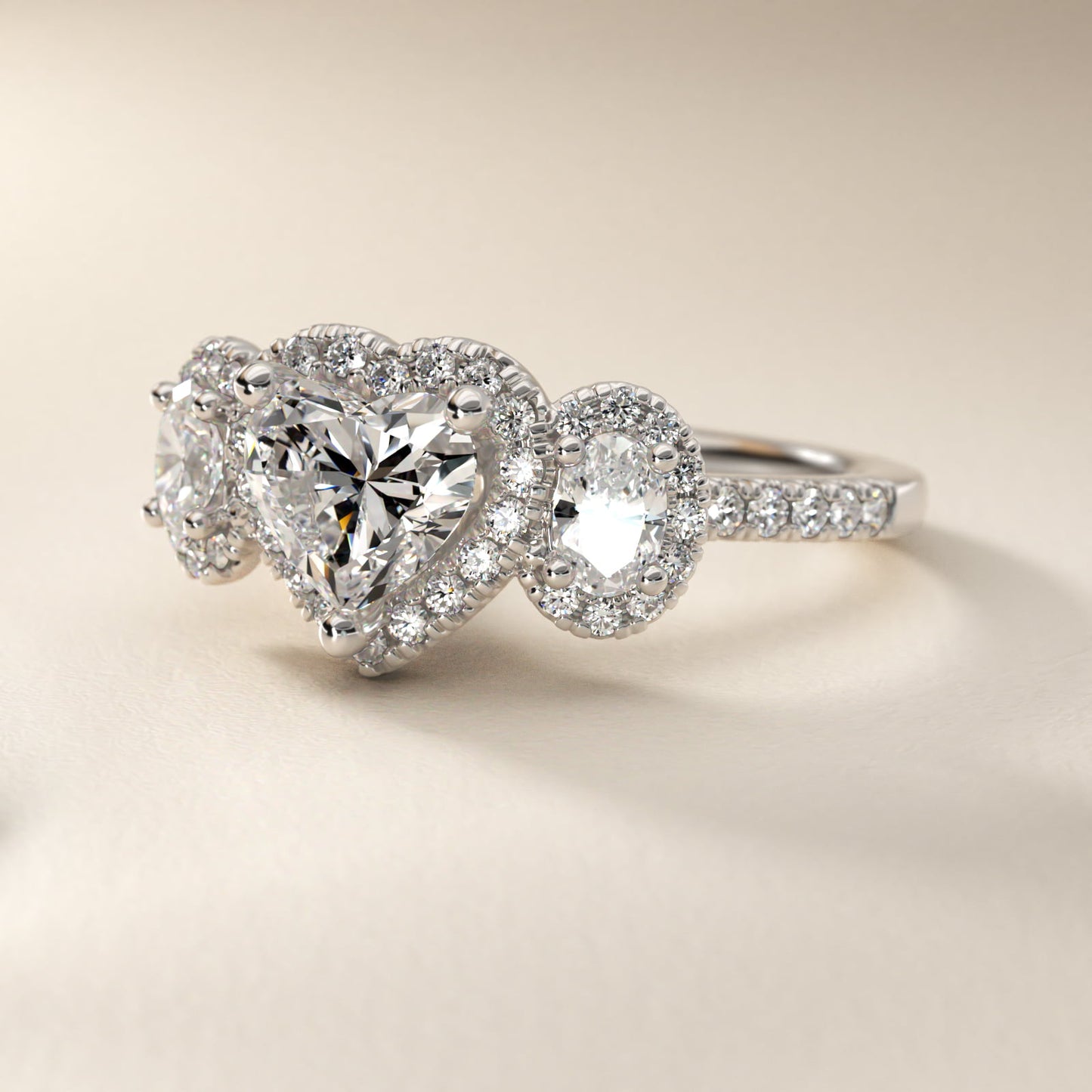 Three-Stone Oval Halo Diamond Engagement Ring in Platinum - Heart Center