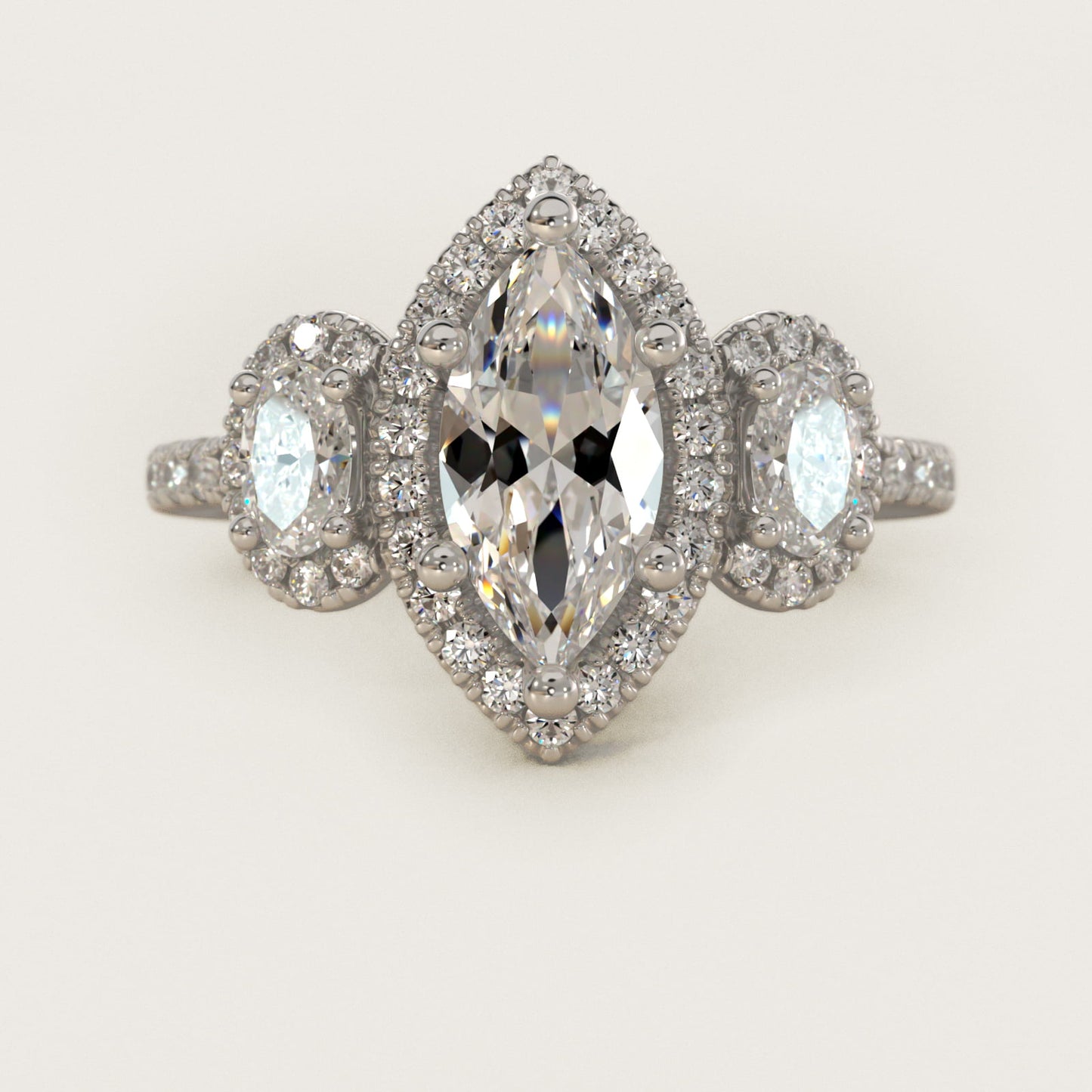 Three-Stone Oval Halo Diamond Engagement Ring in Platinum - Marquise Center