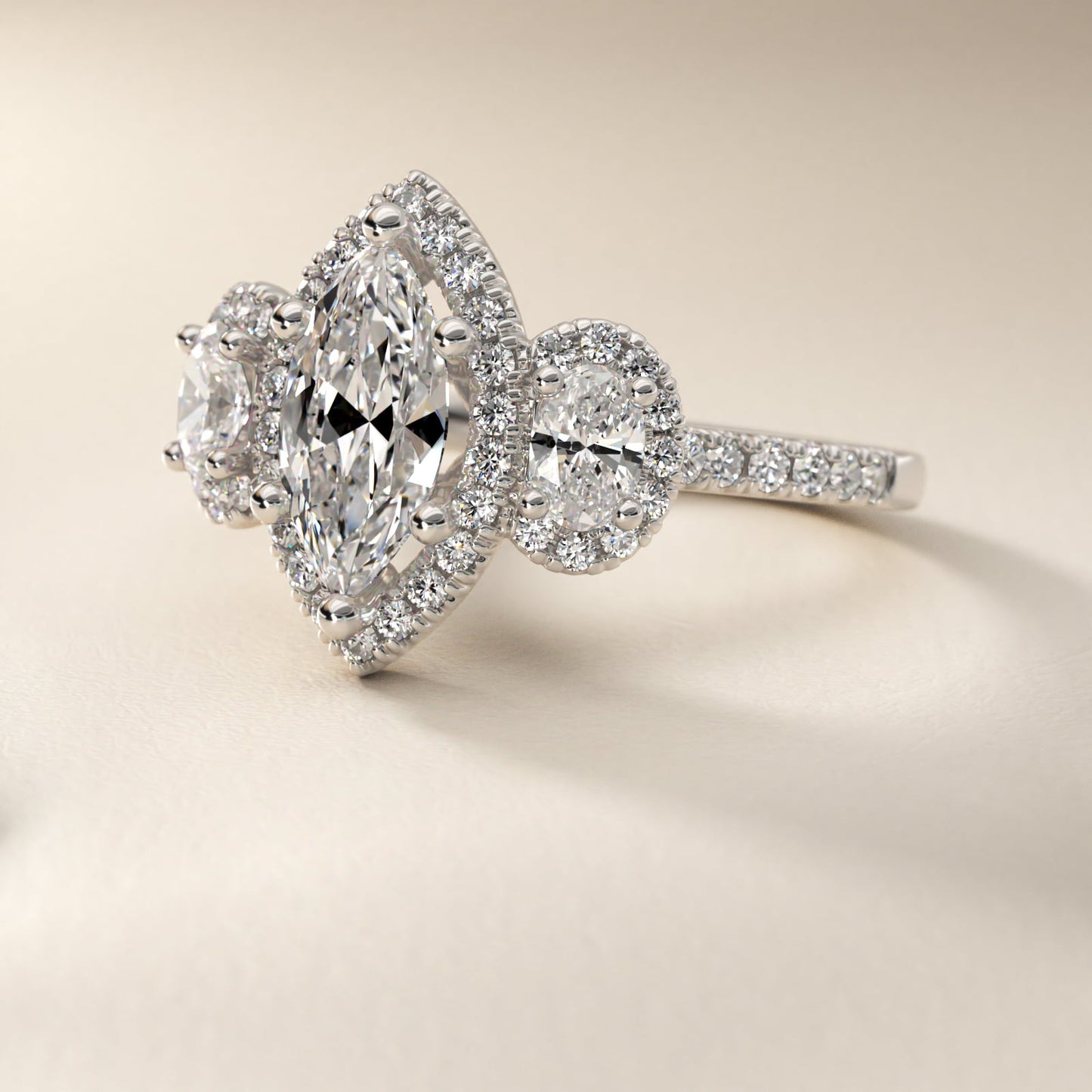 Three-Stone Oval Halo Diamond Engagement Ring in Platinum - Marquise Center