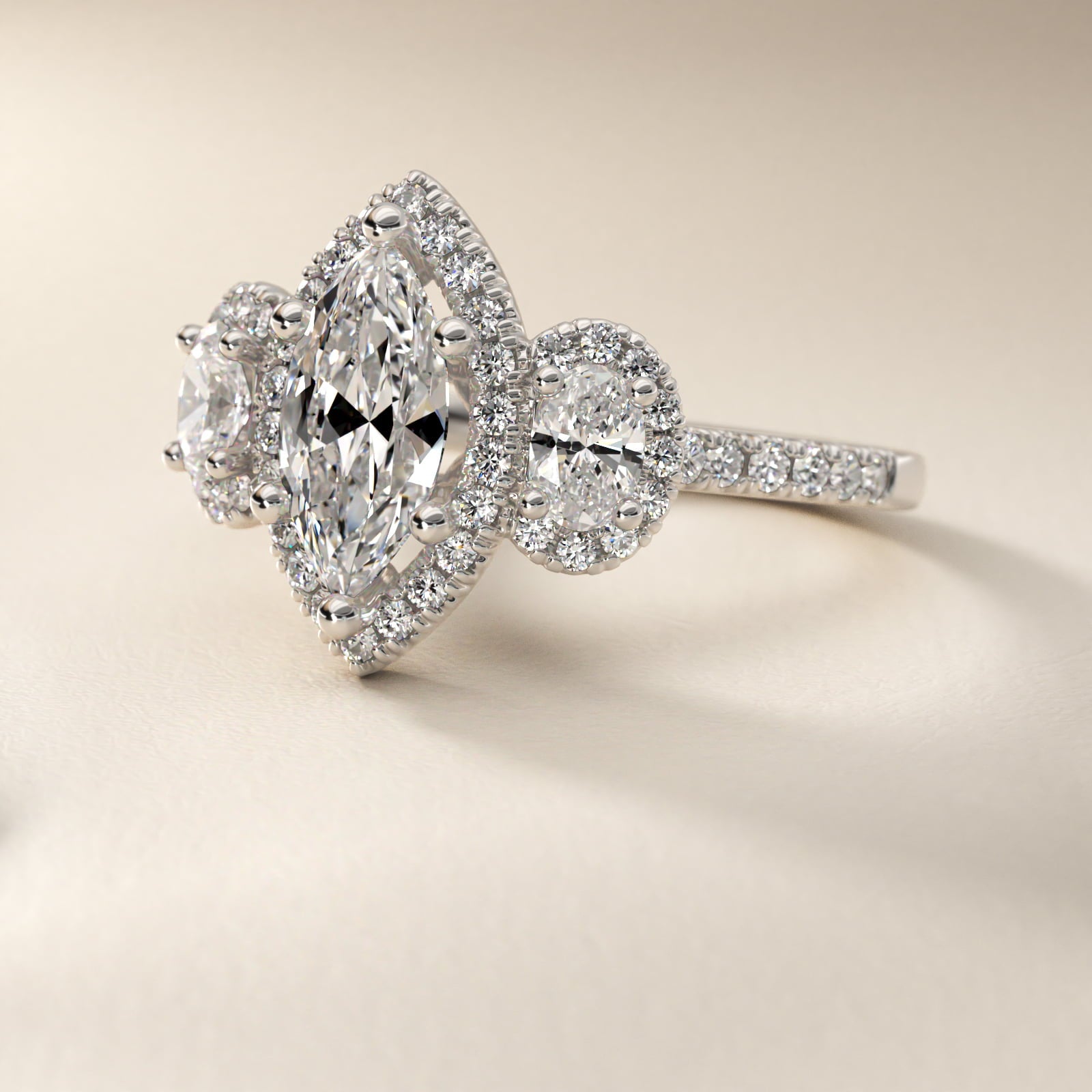 Three-Stone Oval Halo Diamond Engagement Ring in Platinum - Marquise Center