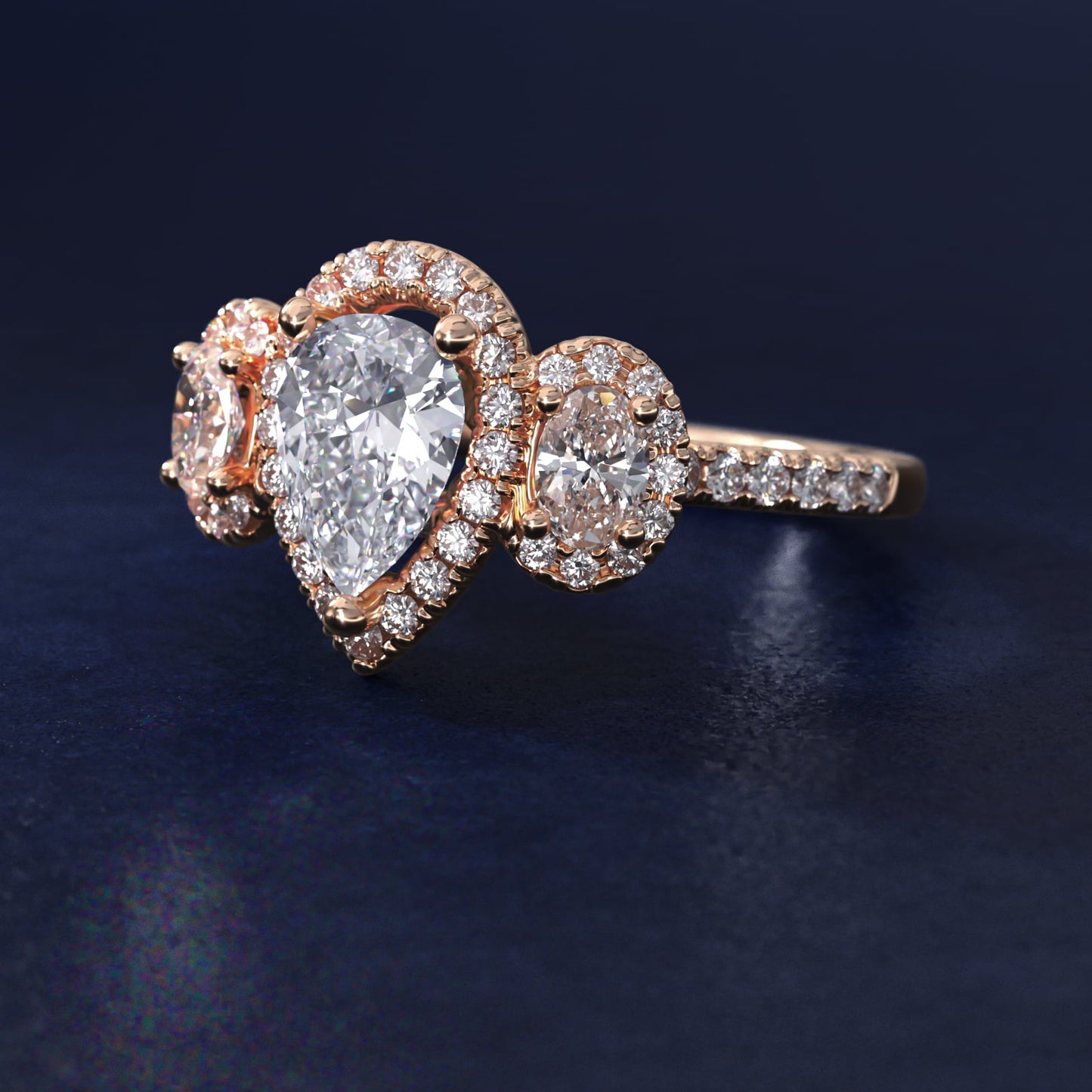 Three-Stone Oval Halo Diamond Engagement Ring in 18k Rose Gold - Pear Center