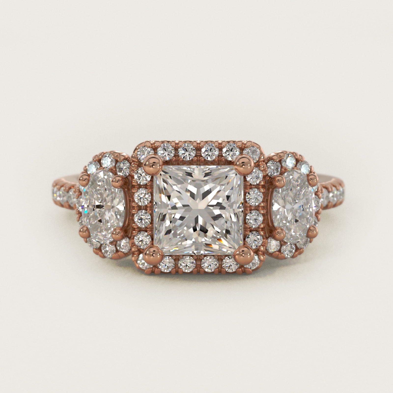 Three-Stone Oval Halo Diamond Engagement Ring in 14k Rose Gold - Princess Center