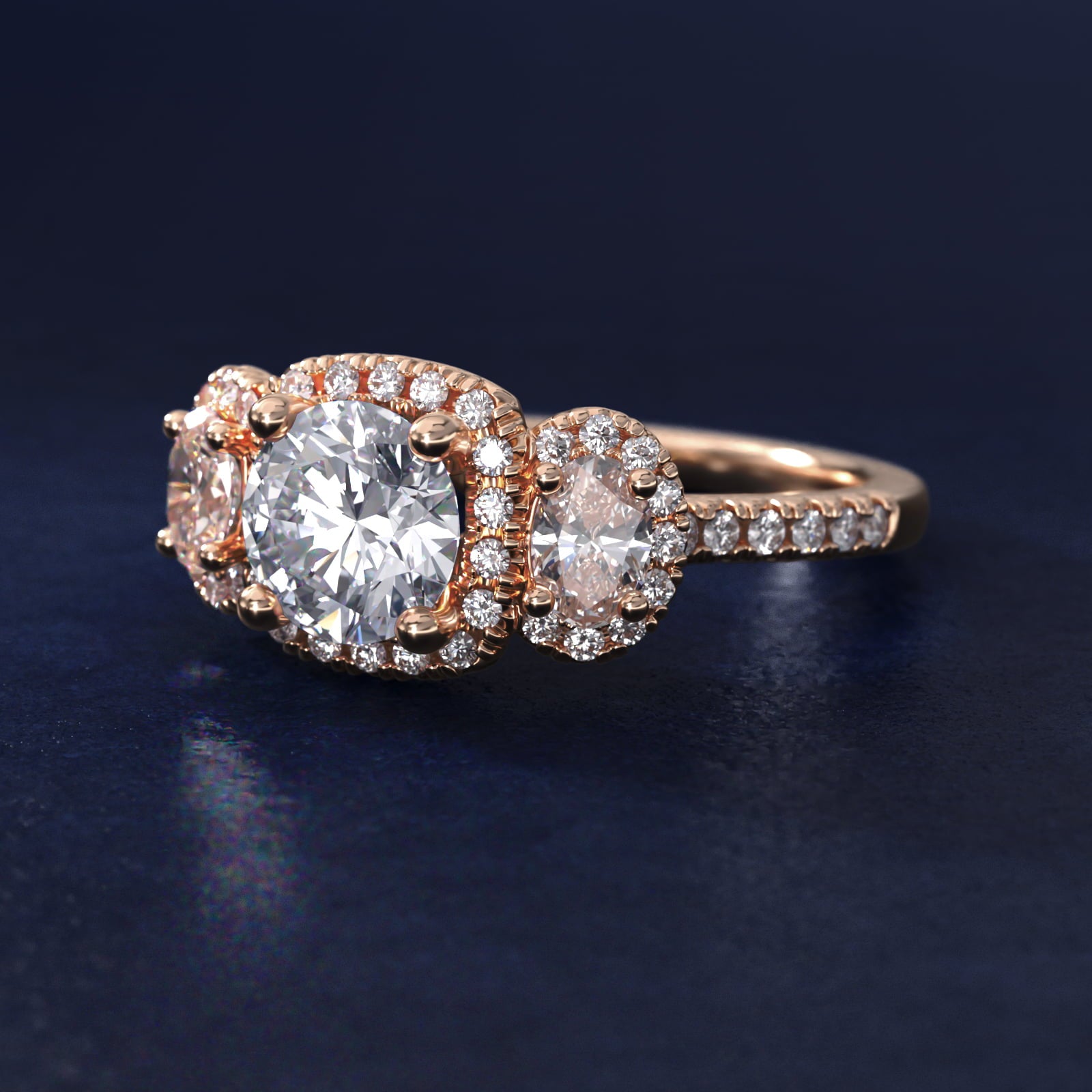 Three-Stone Oval Halo Diamond Engagement Ring in 14k Rose Gold - Round Center