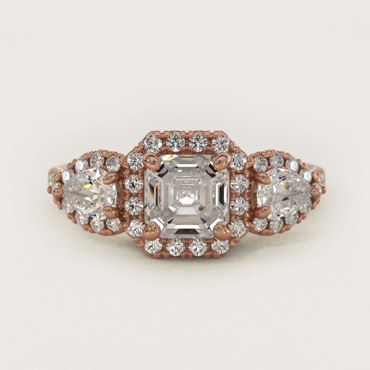Three-Stone Pear Halo Diamond Engagement Ring in 14k Rose Gold - Asscher Center