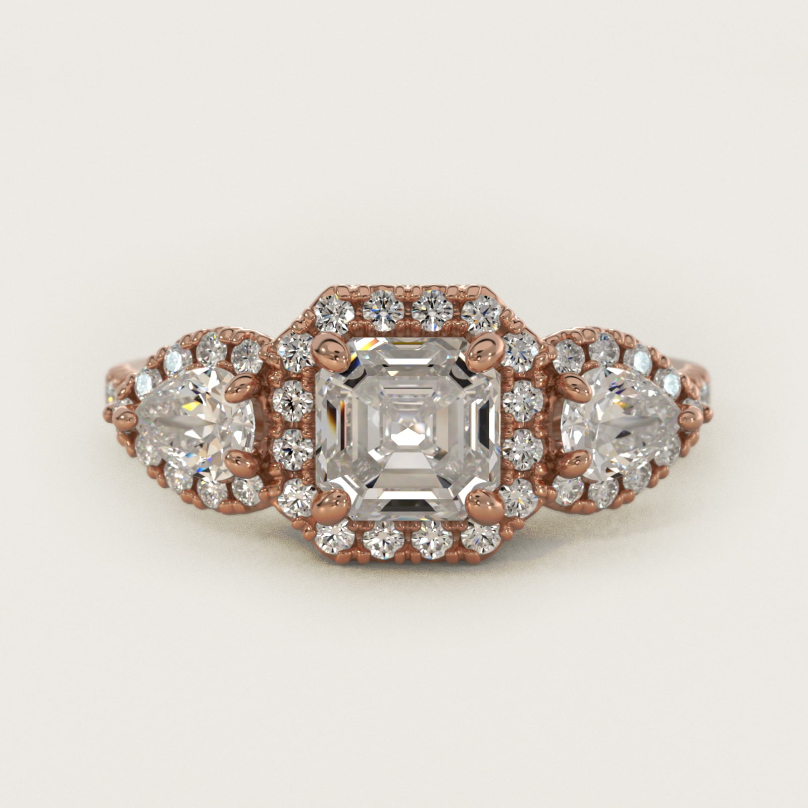 Three-Stone Pear Halo Diamond Engagement Ring in 14k Rose Gold - Asscher Center
