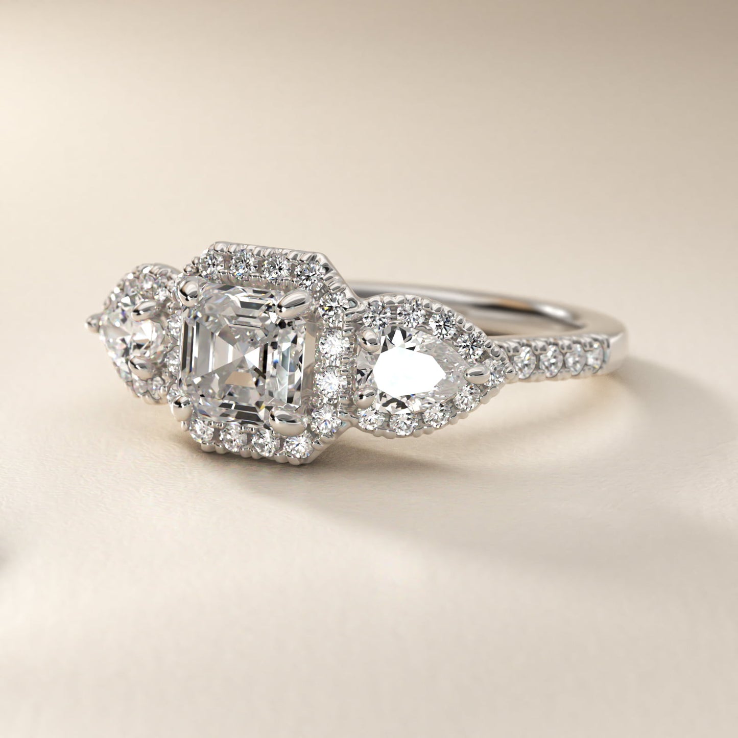 Three-Stone Pear Halo Diamond Engagement Ring in 18k White Gold - Asscher Center