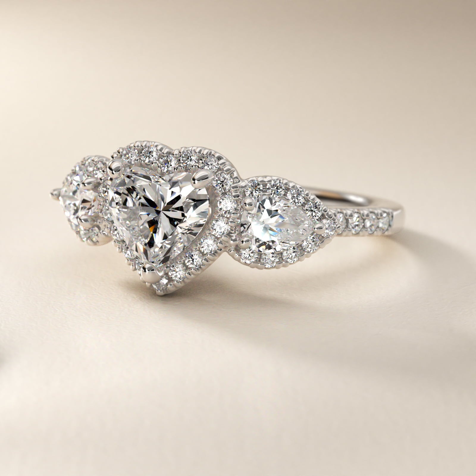 Three-Stone Pear Halo Diamond Engagement Ring in 18k White Gold - Heart Center