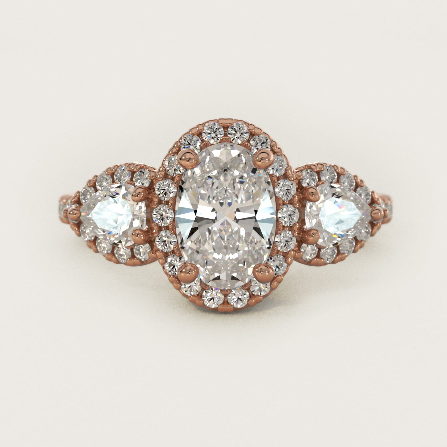 Three-Stone Pear Halo Diamond Engagement Ring in 14k Rose Gold - Oval Center