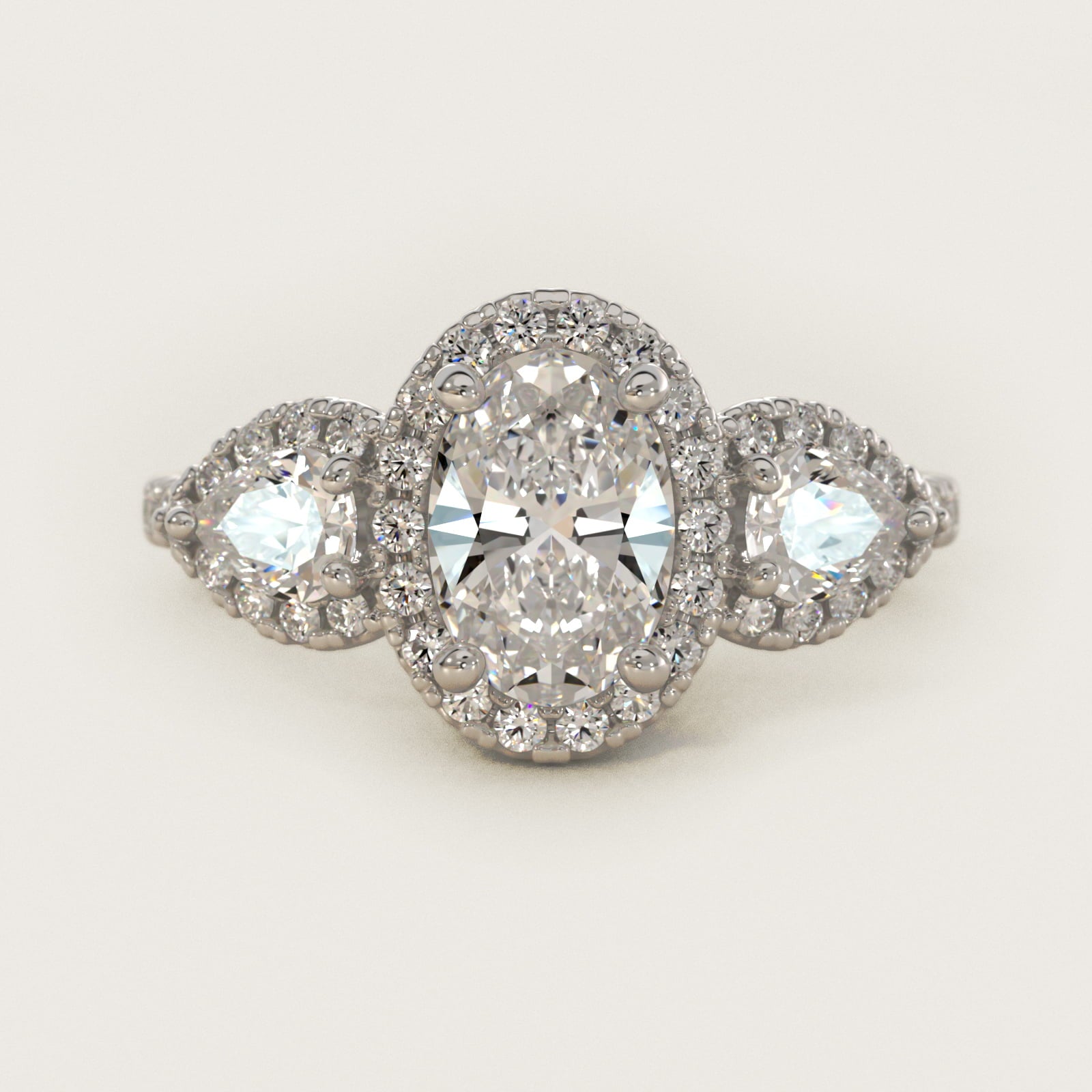 Three-Stone Pear Halo Diamond Engagement Ring in 18k White Gold - Oval Center
