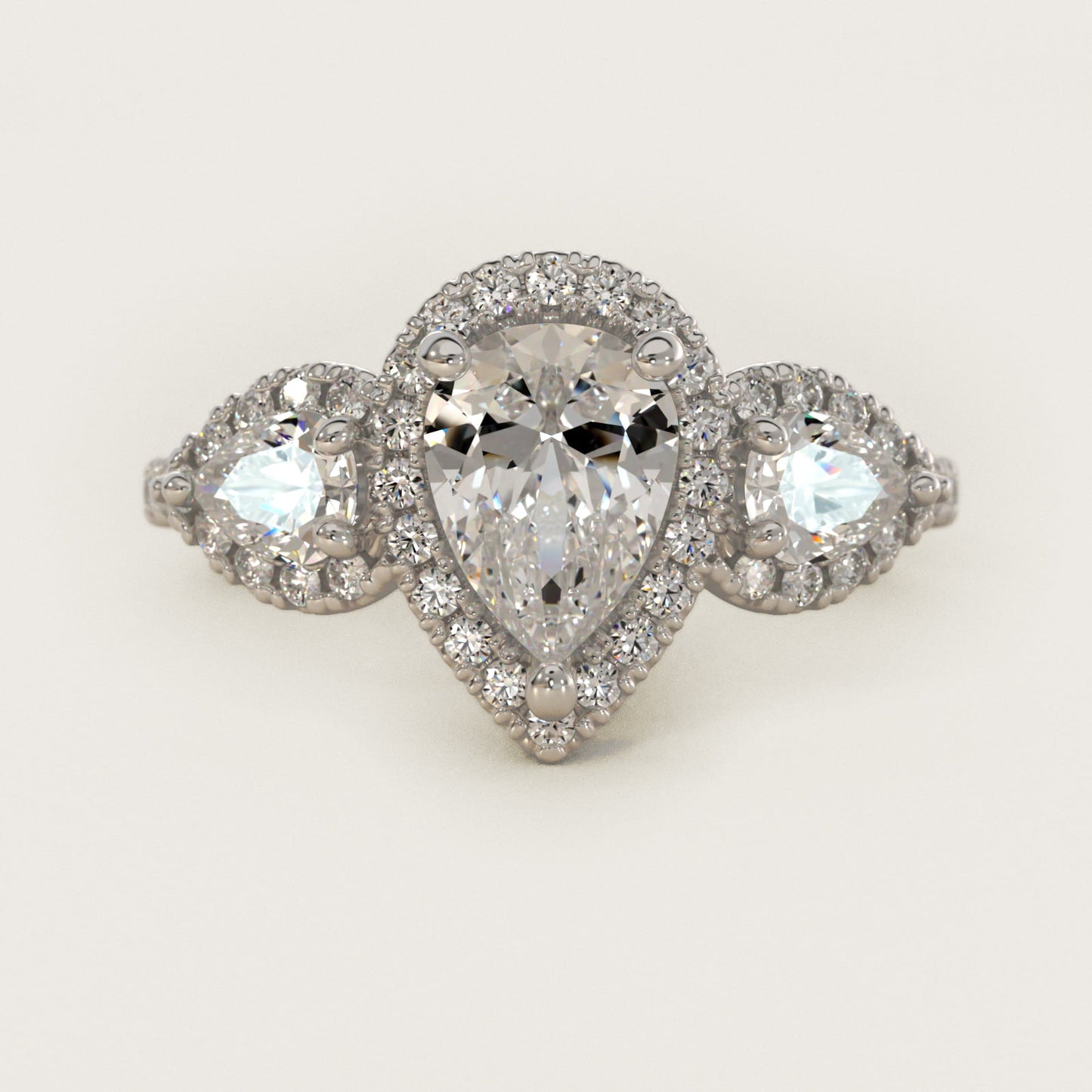 Three-Stone Pear Halo Diamond Engagement Ring in Platinum - Pear Center