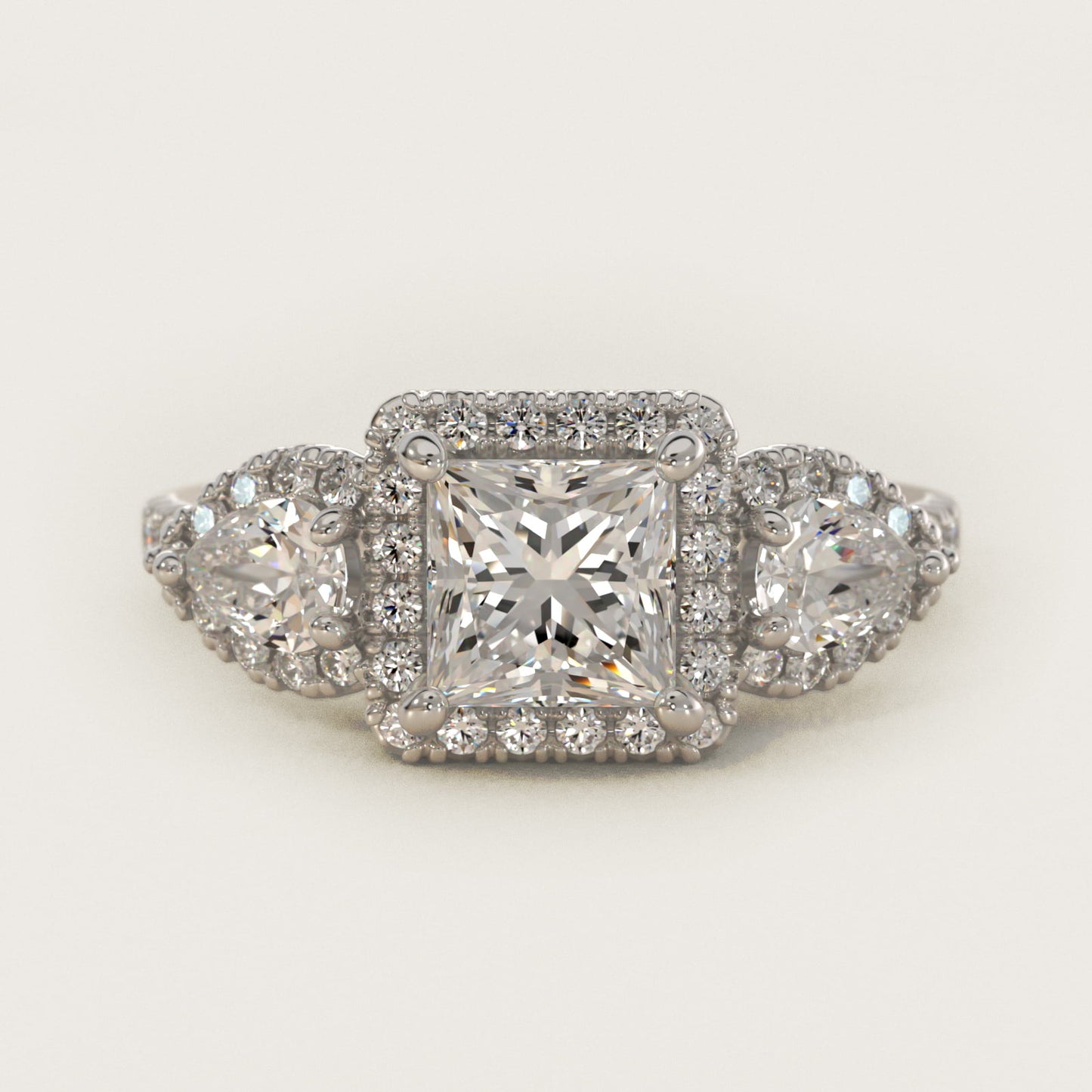 Three-Stone Pear Halo Diamond Engagement Ring in Platinum - Princess Center