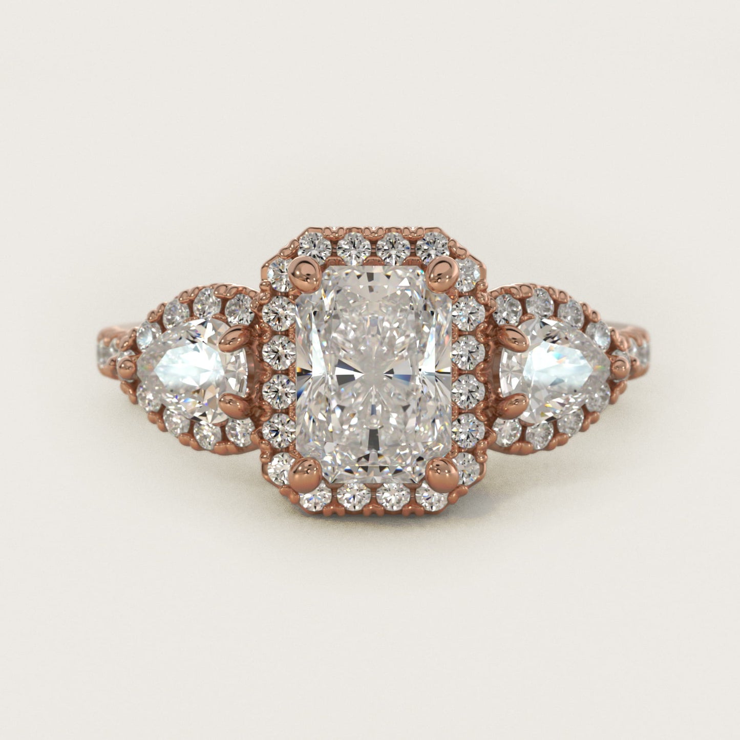 Three-Stone Pear Halo Diamond Engagement Ring in 14k Rose Gold - Radiant Center