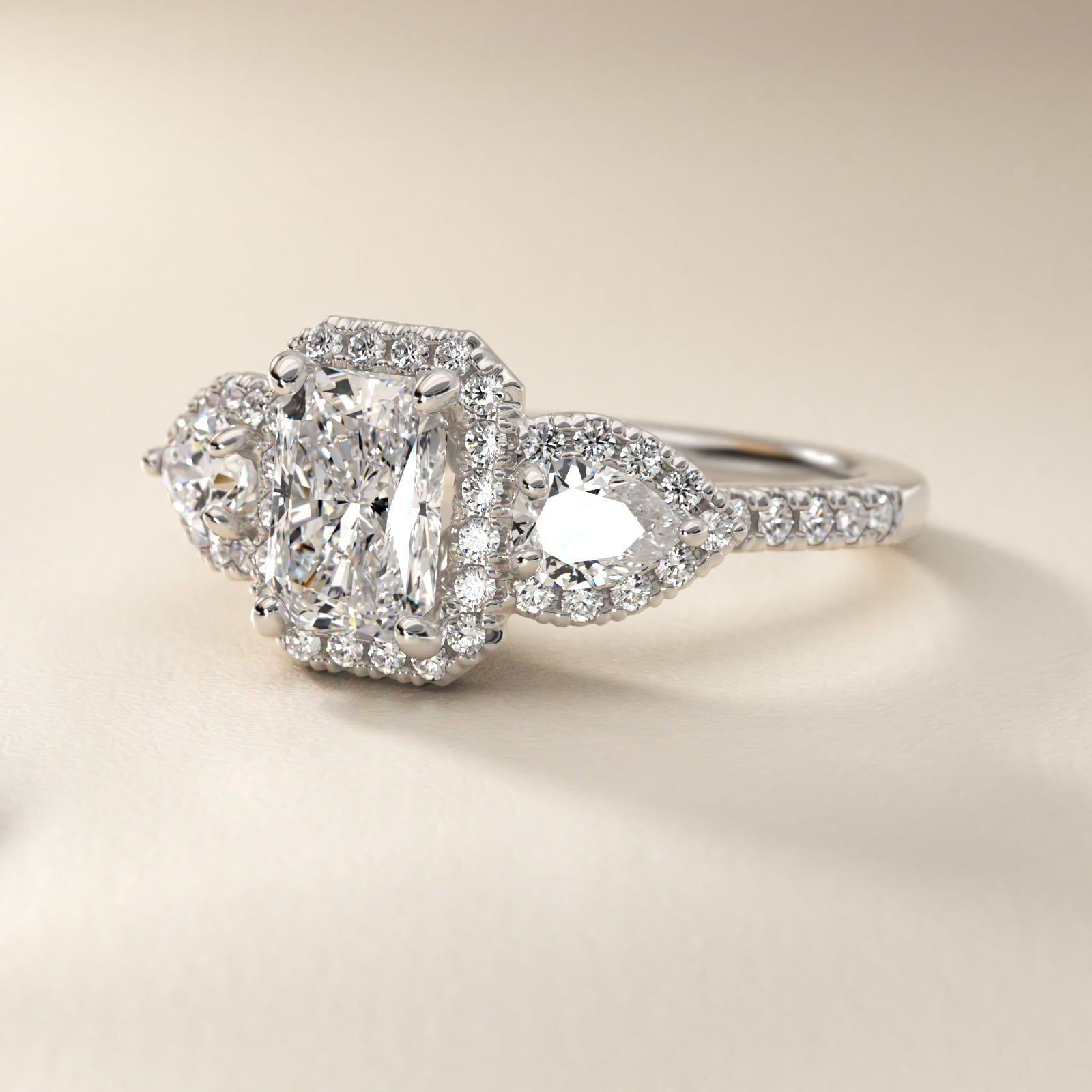 Three-Stone Pear Halo Diamond Engagement Ring in 18k White Gold - Radiant Center