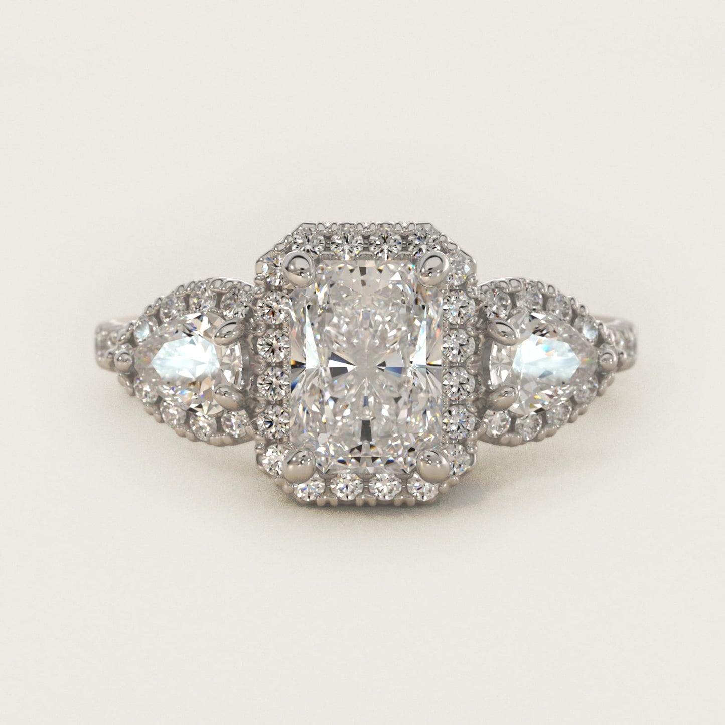 Three-Stone Pear Halo Diamond Engagement Ring in Platinum - Radiant Center