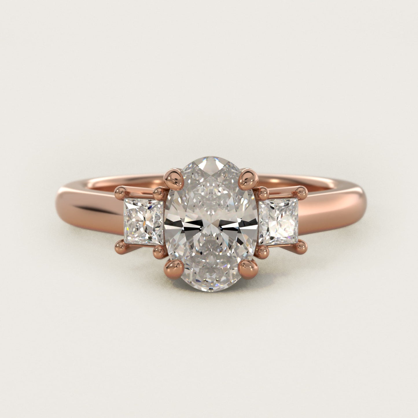 Three-Stone Princess Diamond Engagement Ring in 14k Rose Gold (1/3 ct. tw.) - Oval Center