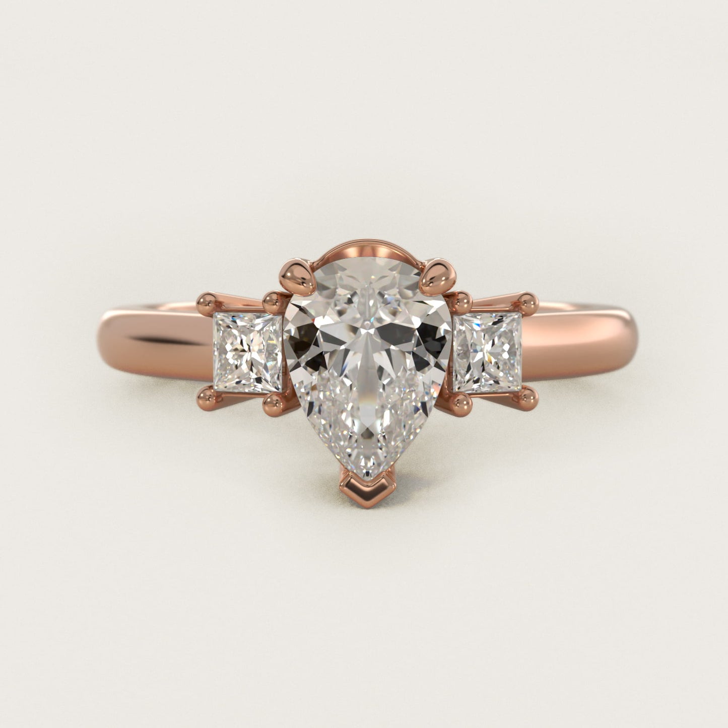 Three-Stone Princess Diamond Engagement Ring in 14k Rose Gold (1/3 ct. tw.) - Pear Center