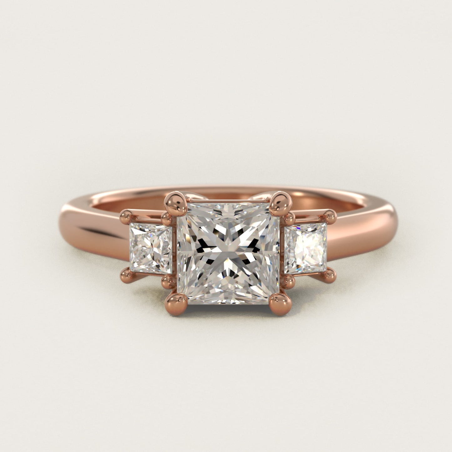 Three-Stone Princess Diamond Engagement Ring in 14k Rose Gold (1/3 ct. tw.) - Princess Center