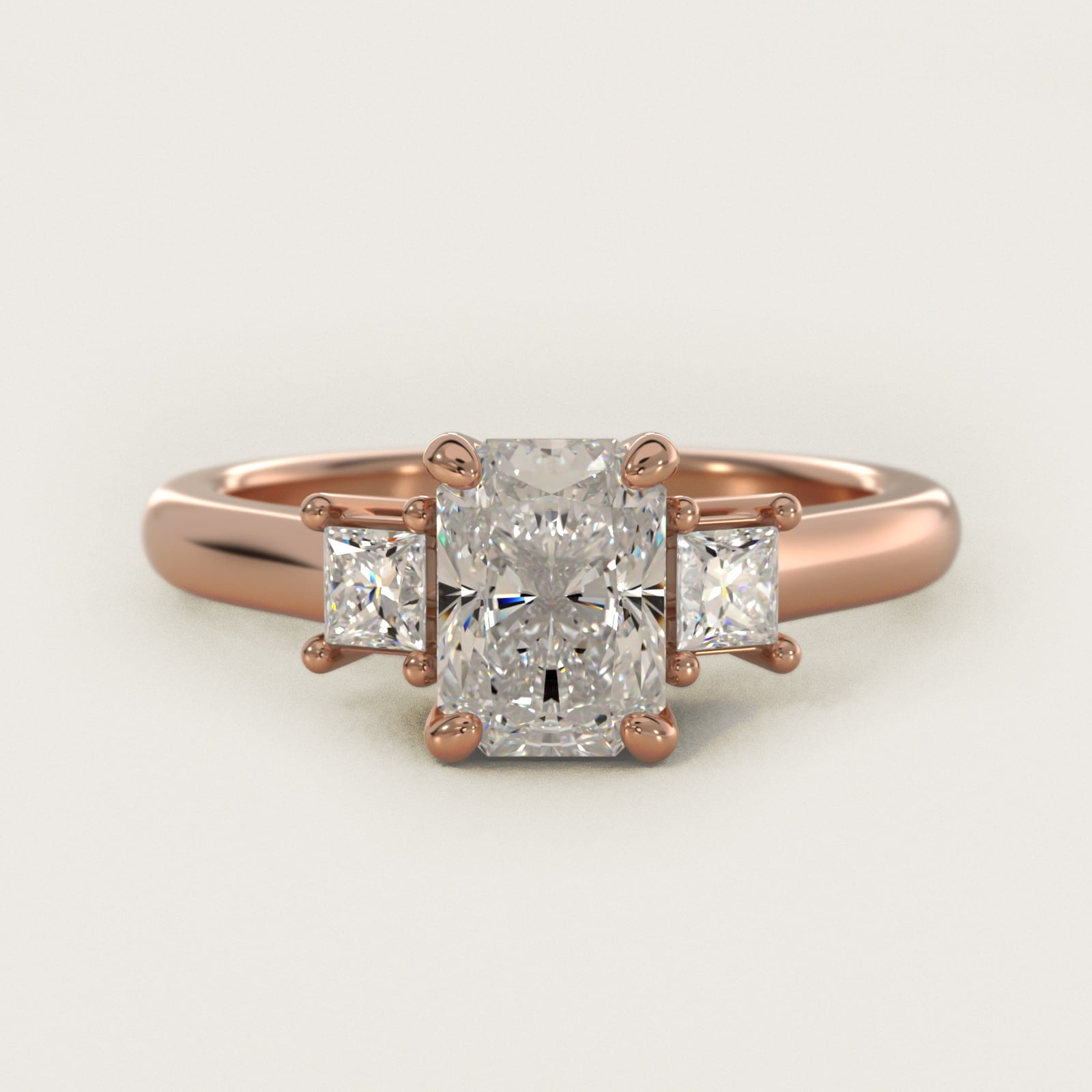 Three-Stone Princess Diamond Engagement Ring in 18k Rose Gold (1/3 ct. tw.) - Radiant Center