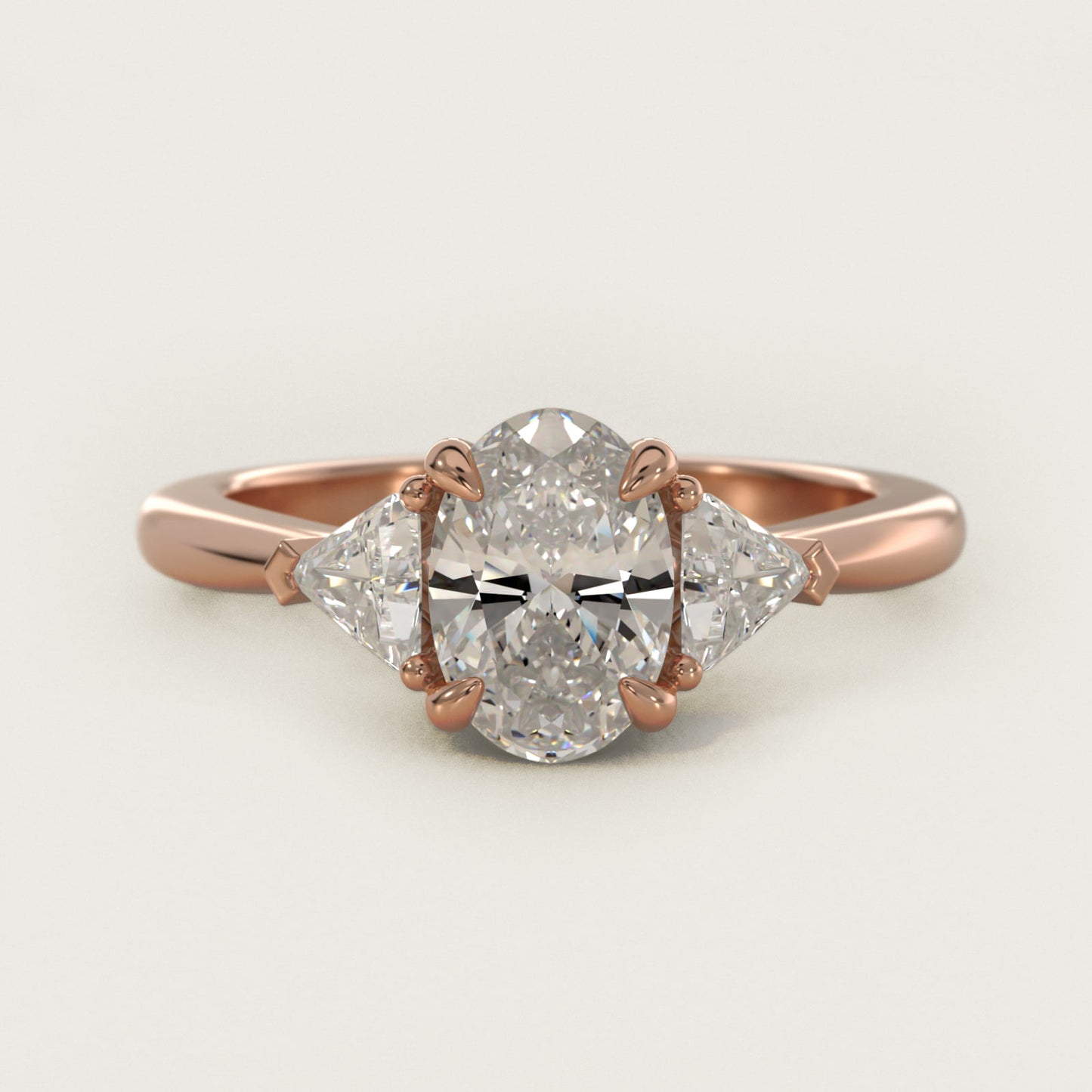Three-Stone Trillion Diamond Engagement Ring in 14k Rose Gold (1/3 ct. tw.) - Oval Center