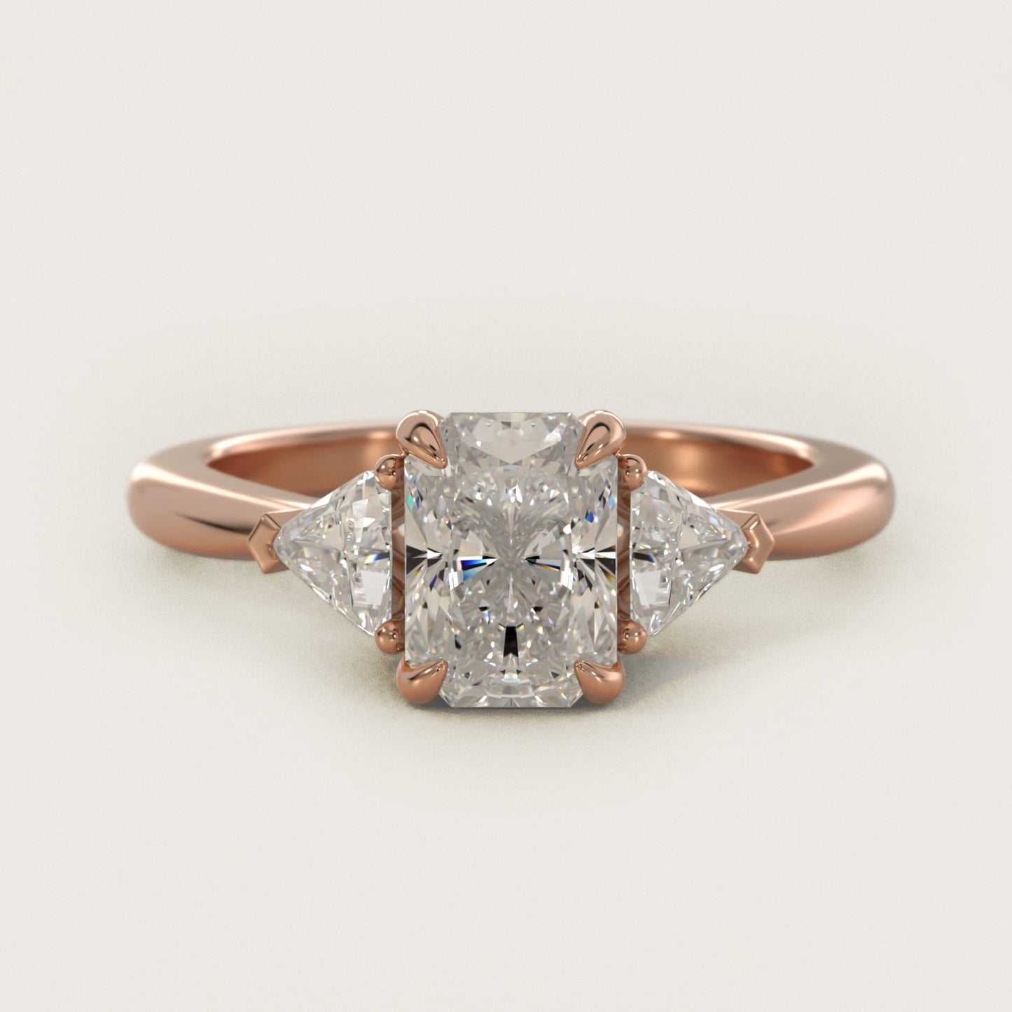 Three-Stone Trillion Diamond Engagement Ring in 14k Rose Gold (1/3 ct. tw.) - Radiant Center