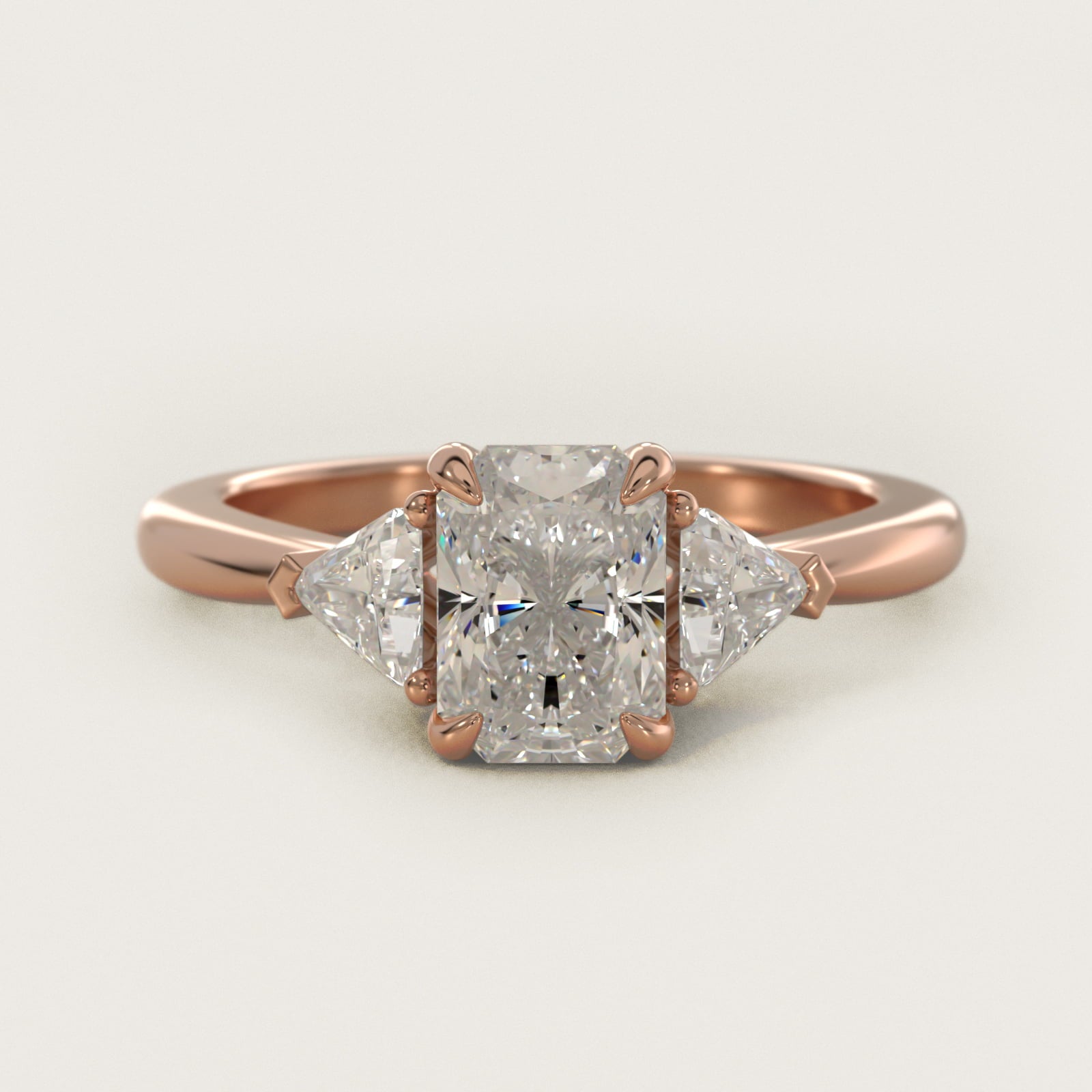 Three-Stone Trillion Diamond Engagement Ring in 14k Rose Gold (1/3 ct. tw.) - Radiant Center